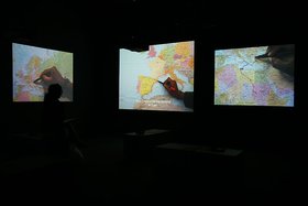 Bouchra Khalili, The Mapping Journey Project, 2008-2011, video installation, 8 single channels, installation view, 10th Sharjah Biennale, 2011. Courtesy of the artist. Photo by Haupt & Binder.