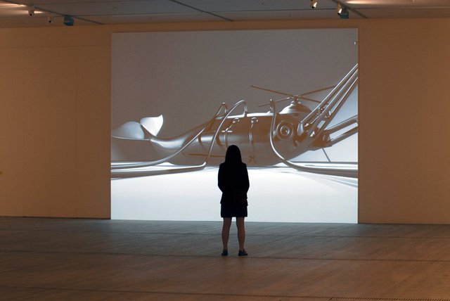 Mona Marzouk, The Bride Stripped Bare by Her Energy's' Evil, 2006, two large scale wall paintings (10 m each + acrylic colors), audio elements and a projected short 3D animated film,  2 min. 44 sec. Installation view at BALTIC Centre for Contemporary Art, Gateshead, UK.