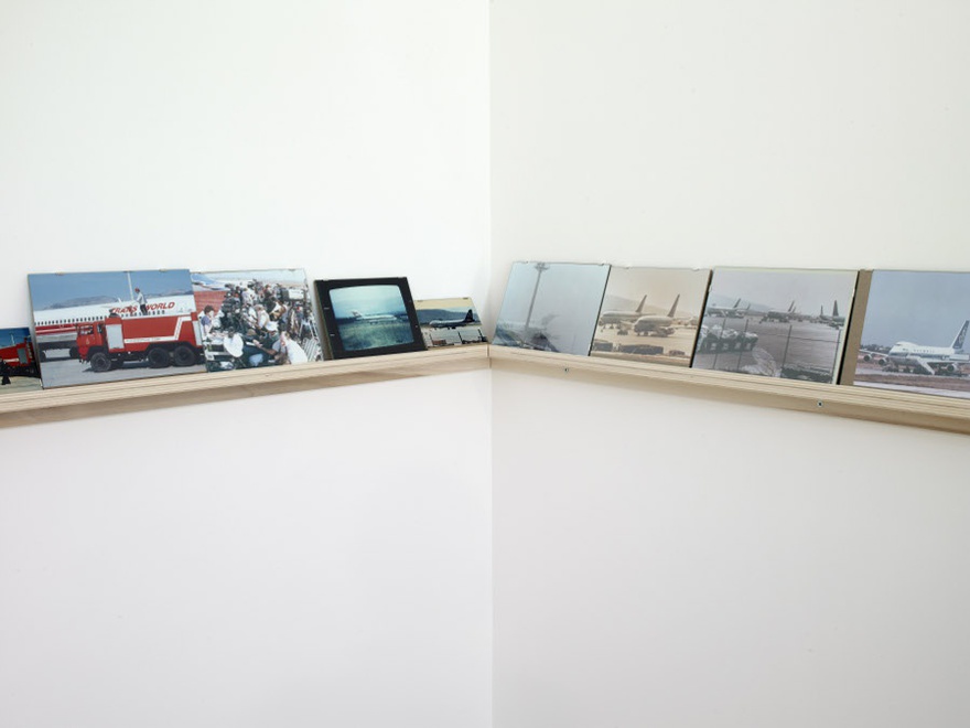 Vangelis Vlahos, Aircrafts on Ground, 2009-2010. 57 photographs (variable dimensions) on a wall mounted shelf (length 12 m). Installation view at Serralves Museum of Contemporary Art, Porto, 2010.