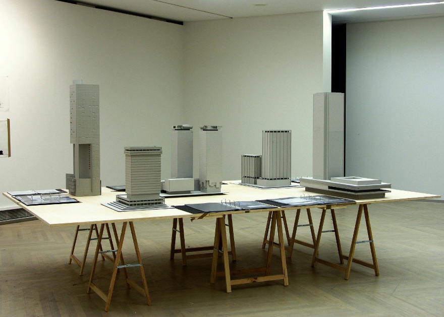 Vangelis Vlahos, Buildings like texts are socially constructed, 2004. 5 models, 7 dossiers, table (360 x 220 x 74cm). Installation view at Manifesta 5, San Sebastian, 2004.