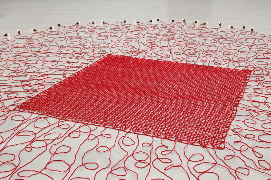 Mona Hatoum, Undercurrent (red), 2008. Electrical wires covered in fabric, with light bulbs and dimmer switch, variable dimensions.