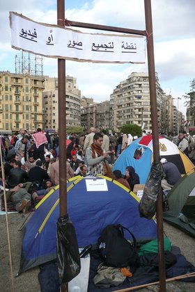 Activists built a media camp for gathering multimedia in Tahrir Square. The paper says: 'focal point to gather pictures and videos'