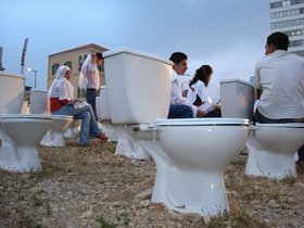 Nada Sehnaoui, Haven’t 15 Years of Hiding in the Toilets Been Enough?, Beirut, 2008, 600 toilet seats. Courtesy of the artist.