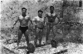 Akram Zaatari, Bodybuilders, Printed From A Damaged Negative Showing From Left To Right: Hassan El Aakkad, Munir El Dada And Mahmoud El Dimassy In Saida, 1948, 2011. Inkjet print. 180 x 145 cm. 70 7/8 x 57 1/8 in.