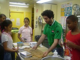 Michael Rakowitz, Enemy Kitchen, 2006-ongoing, performance, Hudson Guild Community Center, New York, NY. Courtesy the artist and Lombard Freid Gallery.