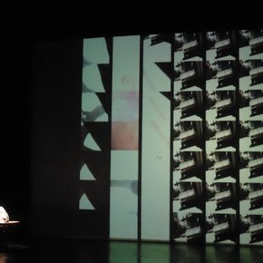 Rabih Mroué performing <em>The Pixelated Revolution,</em> Staatstheater, Kassel, Documenta 13, June 7, 2012. Copyright: ATP/Ibraaz Publishing, 2012.