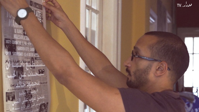 Egyptian artist Mahmoud Khaled adding some final touches to the exhibition.