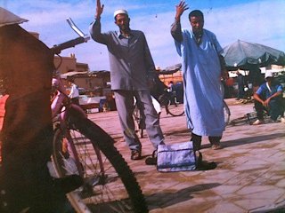 Al Azalia and a friend, performing in the square.