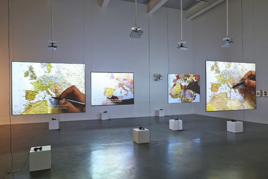 Bouchra Khalili, The Mapping Journey Project, Video installation. 8 single channels, 2008-2011. View of the installation at Here & Elsewhere, The New Museum, New York, July 2014.