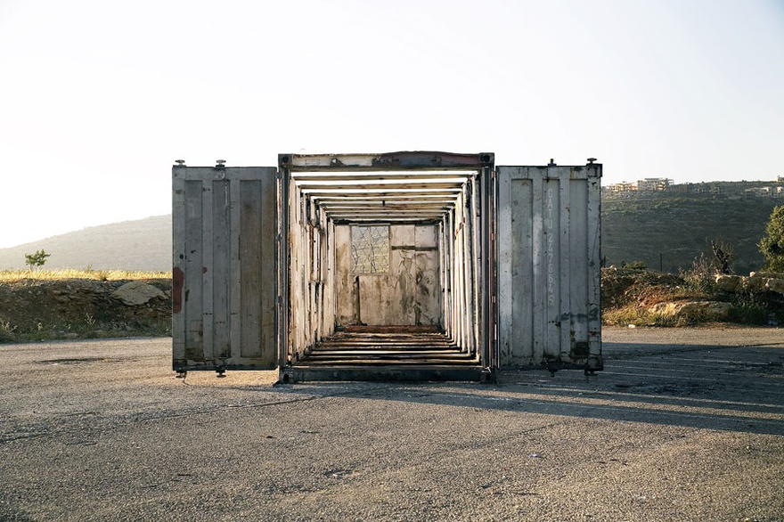 Nida Sinnokrot, Jonah’s Whale, 2014. Hand-cut Israeli Caravan repurposed as Palestinian construction site office. 480 x 1200 x 240 cm.