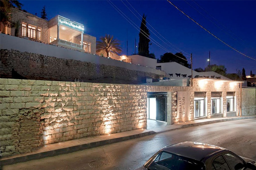 Darat al Funun’s The Lab (foreground), and Headquarters (background) with an installation by James Webb, There is a Light that Never Goes Out, 2010. Neon light, 394 x 89 cm, installed in 2011. The Khalid Shoman Collection.