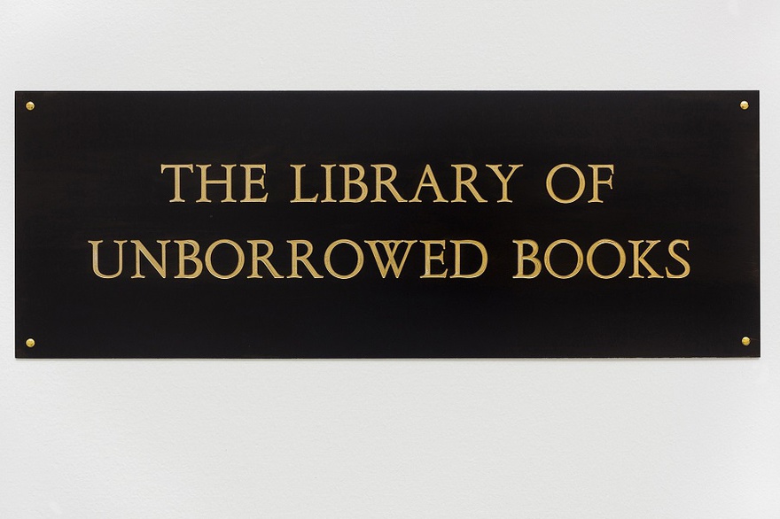 Meriç Algun Ringborg, The Library of Unborrowed Books, 2012. Site-specific installation with books, shelves, brass sign, two contracts. Section I: Stockholms Stadsbibliotek (Stockholm Public Library), 2012 at Konstakademien, Stockholm.