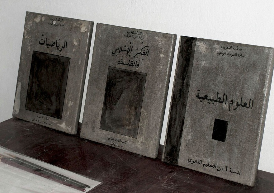 Mohssin Harraki, Pierre dans la marre (detail), 2010. Installation of 40 iron books, engraved and painted. Variable dimenisons. 