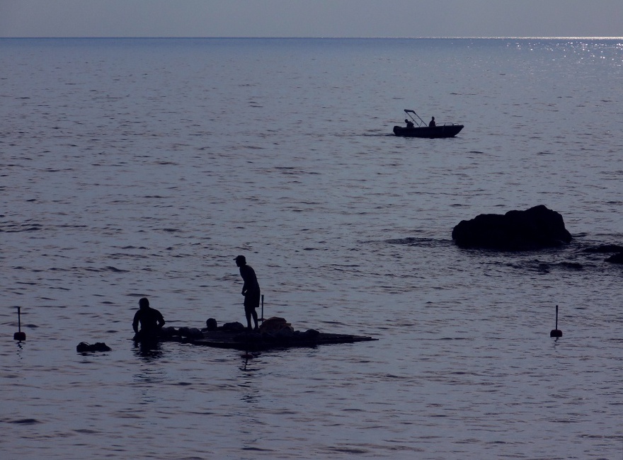 Sculptures are positioned under the raft.