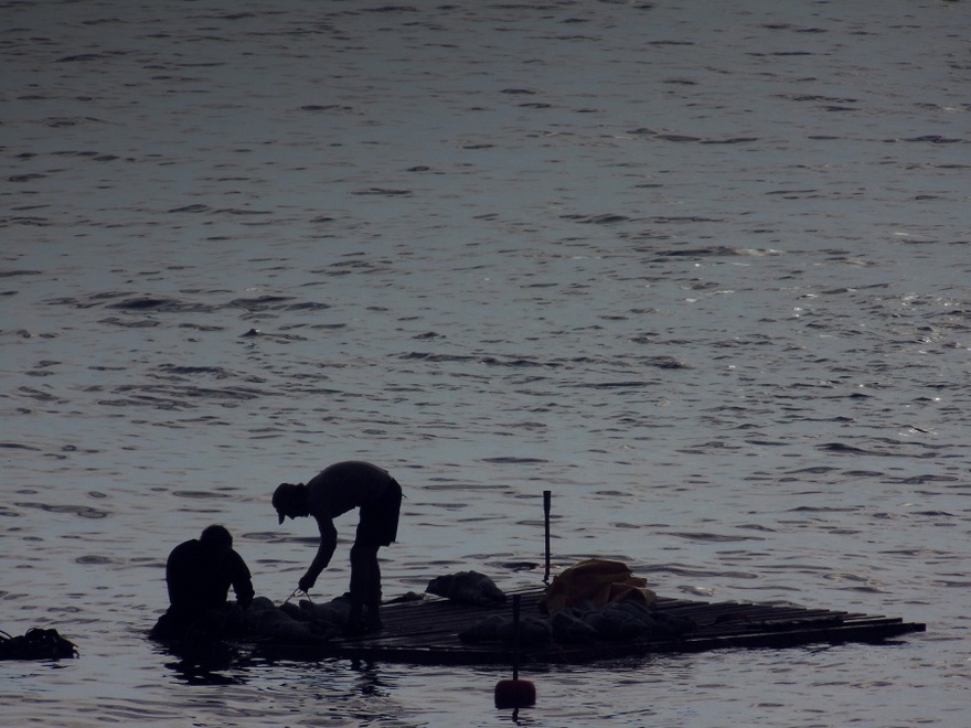 Sculptures are positioned under the raft.